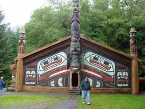 This is a "clan house" - the totem poles tell stories